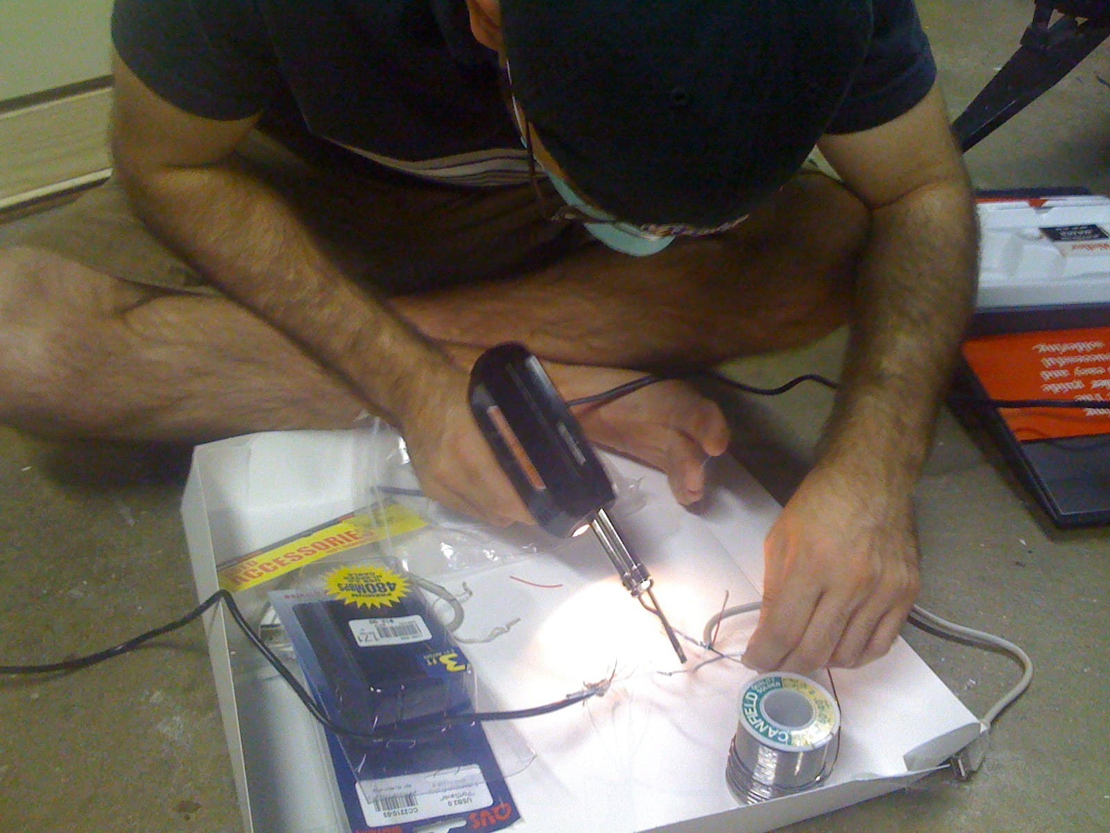 Photo from Xbox Linux: soldering some USB wires together